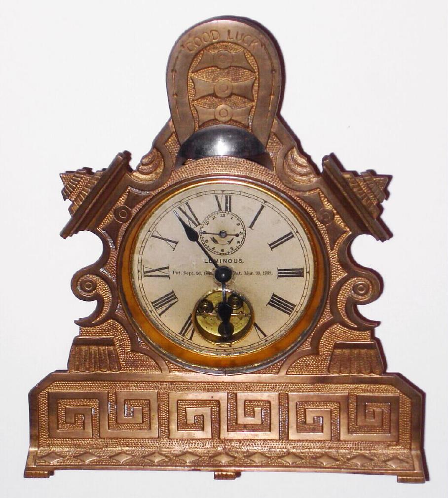 Terry Clock Co., Pittsfield, Mass., Circa 1883, GOOD LUCK, 30-hour alarm timepiece, with exposed balance on dial. — Antique Clocks Price Guide
