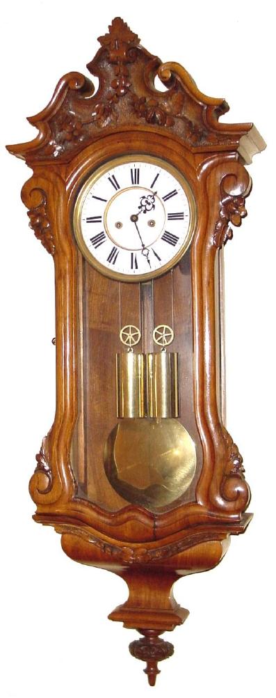 Austrian, C.1860, 2-Wt DWARF "Vienna Regulator" in a light walnut carved case with floral accents and with "built-in" top. Note this is a short case with full size [7"] dial. — Antique Clocks Price Guide