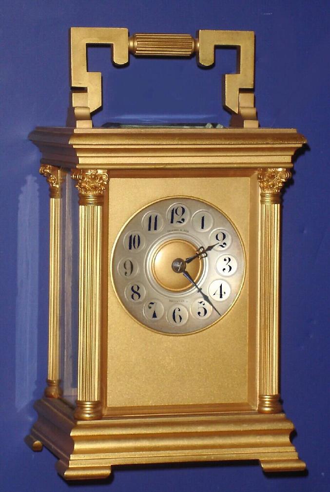 French, Brass Cased Carriage clock, large, over 10 inches tall, retailed by Folkard and Son, Brighton, and in a 4-column Anglaise style case, 8-day time and gong strike. — Antique Clocks Price Guide