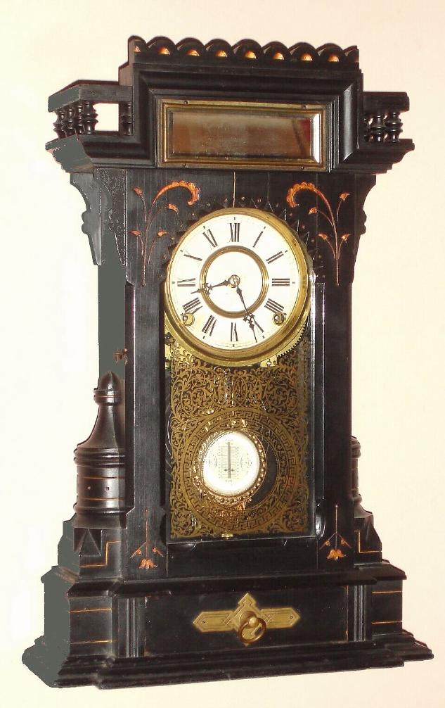 F. Kroeber Clock Co., New York, LEHIGH, ebonized mantel clock with gold accents, and with fancy indicator pendulum and gilt tablet, 8-day gong strike, c.1879 — Antique Clocks Price Guide