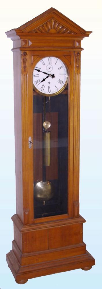 Austrian or So. German, a public building tall clock with auxiliary drive through the top for driving a large set of remote hands, probably a large gallery slave in a bank or department store. With a heavy cast iron plate movement, skeleton in form, similar to a street clock, and with a heavy meter pendulum. The mov't also with maintaining power and Graham's style dead beat escapement with adjustable pallets, C.1900 — Antique Clocks Price Guide