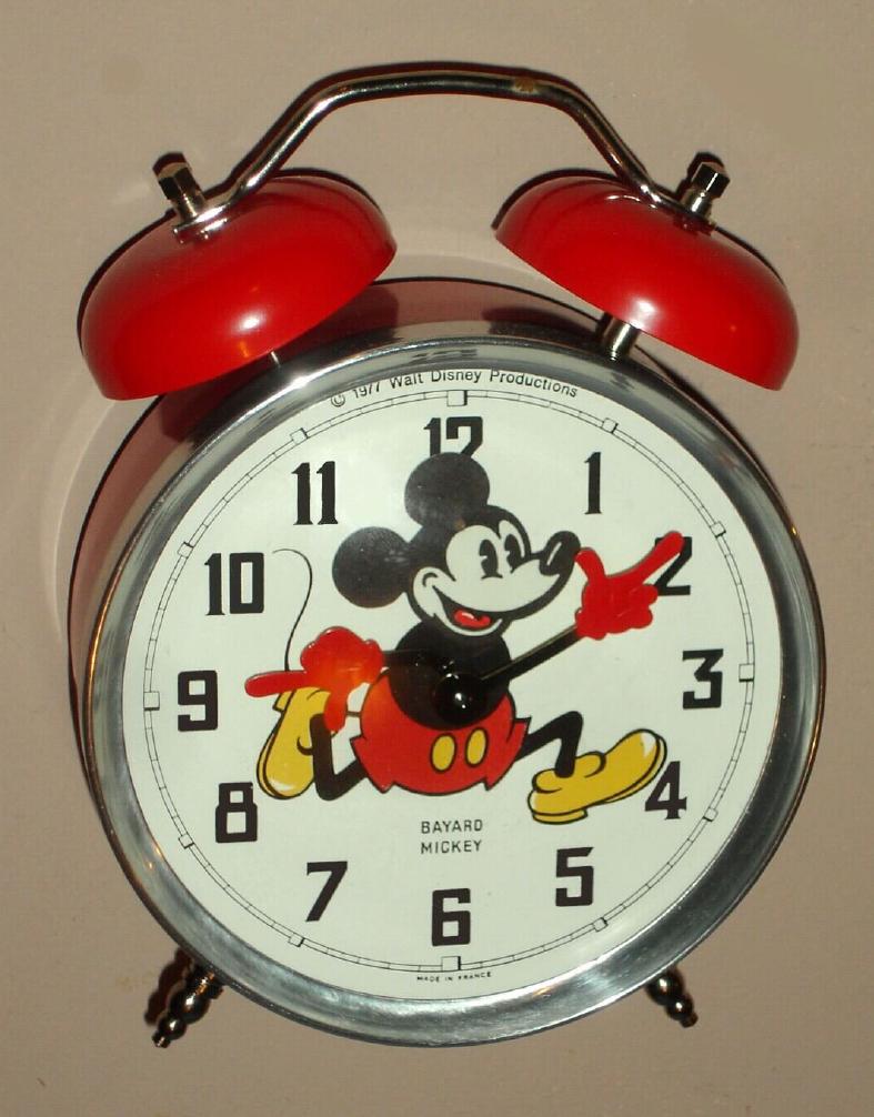 Mickey Mouse mechanical alarm clock automaton with Mickey's hands indicating the hours and minutes and his head ticking, licensed by Walt Disney Productions copyright 1977 Made in France and new old stock, c1977 — Antique Clocks Price Guide