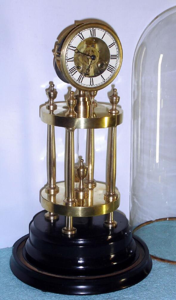 French, unusual mantel regulator, the silk thread movement mounted atop a 4-column temple style stand, under a glass dome, 8-day bell strike. — Antique Clocks Price Guide