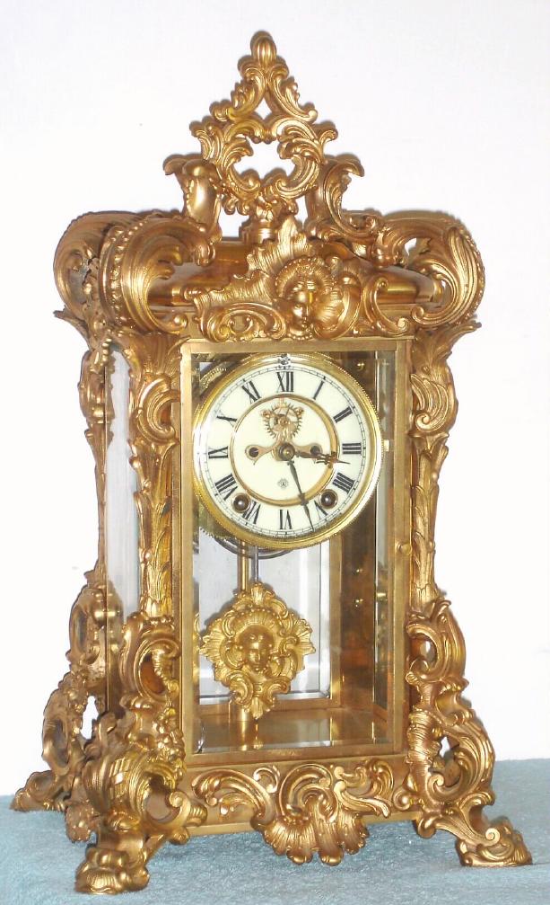 Ansonia Clock Co., NY, APEX crystal regulator, 8-day time and gong strike with open escapement on dial. — Antique Clocks Price Guide