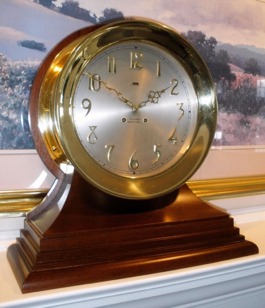 Chelsea Clock Co., Boston, 10 INCH CHELSEA model, Ship's Bell on mahogany base, C.1910, restored, with hinged bezel, button latch, and special dial with raised bronze numerals. — Antique Clocks Price Guide