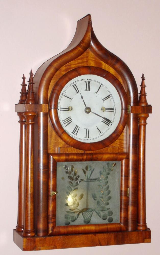 J. C. Brown, Forestville Mfg, Forestville, Conn, four poster gothic w/ ogee top (some call it onion top) case, with well figured mahogany veneer and with cut glass tablet, 8-day FUSEE, C.1848, — Antique Clocks Price Guide