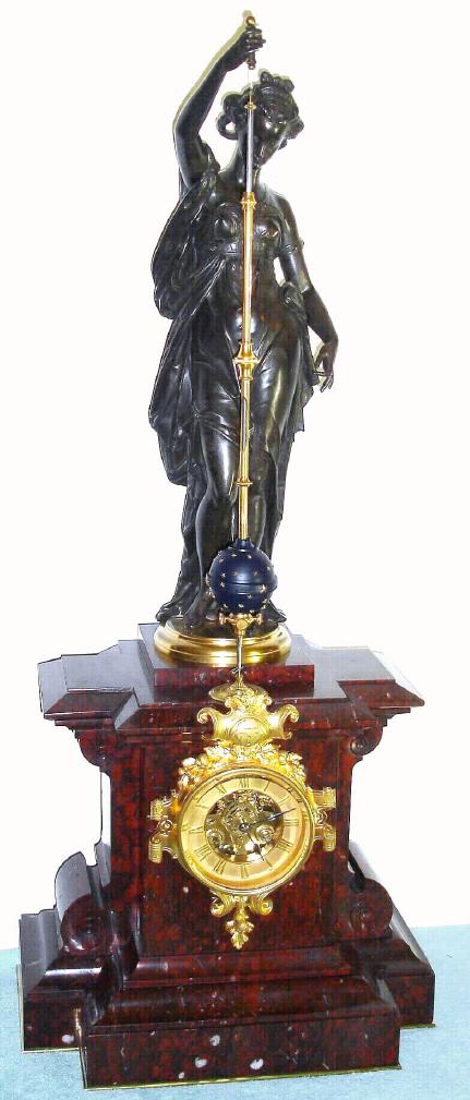 French bronze figural mantel clock with conical pendulum 8 day time and strike spring driven movement in rouge marble case surmounted by a bronze Classical female figure signed "Laurent" holding a polished silvered turned pendulum rod surrounded by a gilt tube and with a star studded blue spherical bob, the dial with applied Roman numeral gilt chapter ring and exposed skeletonized movement, c1870 — Antique Clocks Price Guide