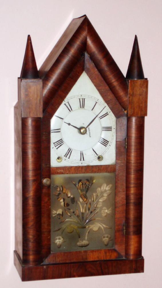 Brewster and Ingrahams, transitional production (E. C. Brewster and Co. signed mov't and dial), rare Kirk's patent iron back-plate repeating mov't (rack and snail), in a rosewood steeple case, C.1843. — Antique Clocks Price Guide