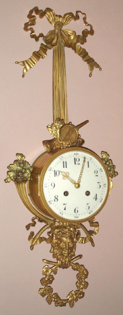 French, Gilt brass cartel clock, Louis XVI style, C.1870 in the style of a century earlier, 8-day bell strike. — Antique Clocks Price Guide