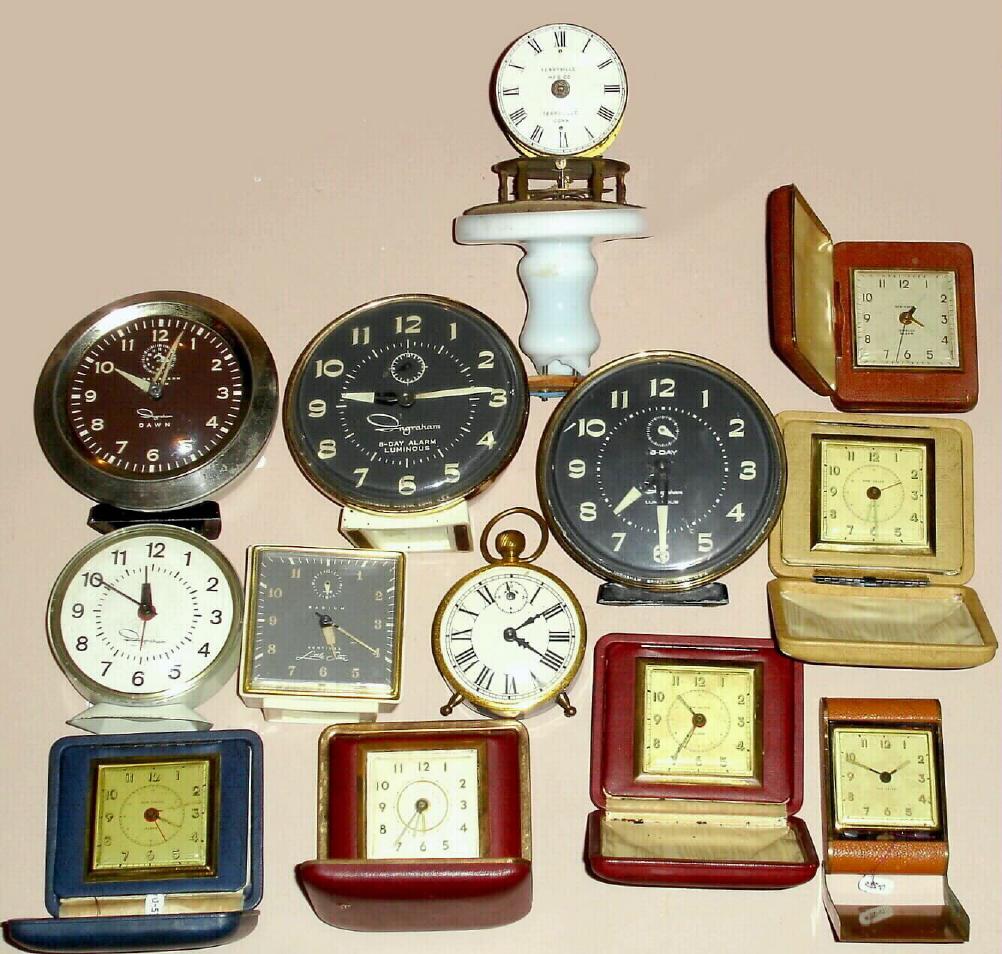 Lot- (6) Ingraham alarm clocks, (6) New Haven travel clocks with leather or faux leather cases and a Terryville Mfg Co. Terryville Conn. candlestick clock — Antique Clocks Price Guide
