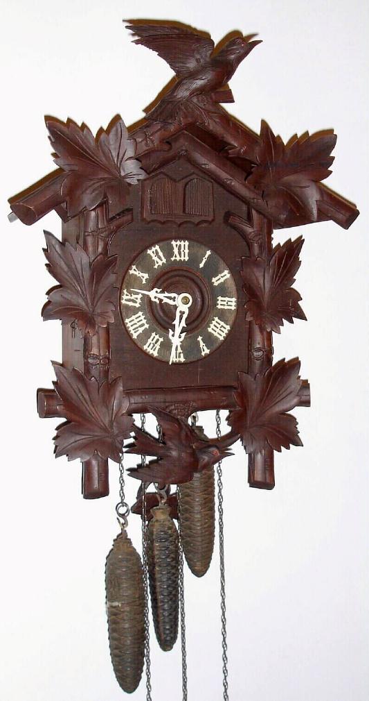 German, Hubert Herr, Triberg cuckoo clock 30 hour, three train, quarter strike weight driven movement with cuckoo and quail, case w/ two bird and six leaf motif, c1910 — Antique Clocks Price Guide