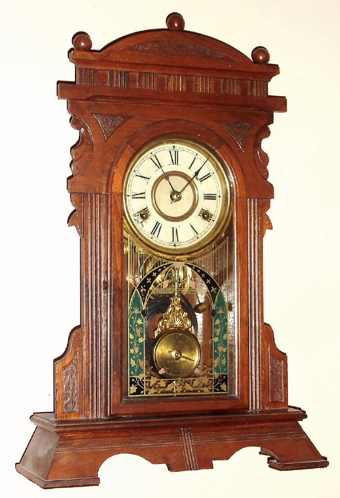 New Haven Clock Co., walnut gingerbread clock, with cathedral gong and indicator pendulum, C.1885 — Antique Clocks Price Guide