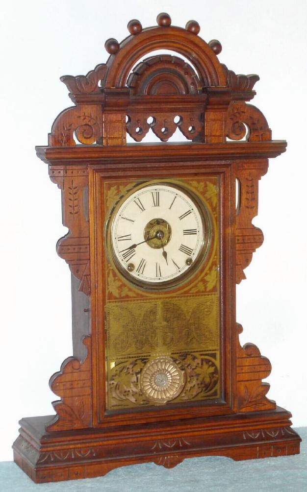 Seth Thomas Clock Co., c.1885, ECLIPSE model walnut parlor clock, time, gong strike and alarm, 8-day, button latch door. — Antique Clocks Price Guide
