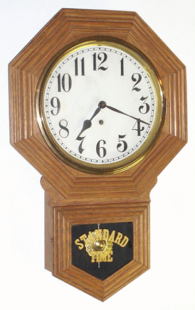 Wm. L. Gilbert Clock Co., oak cased, short drop octagon, model No. 3027, time only, 8-day, c.1915 — Antique Clocks Price Guide