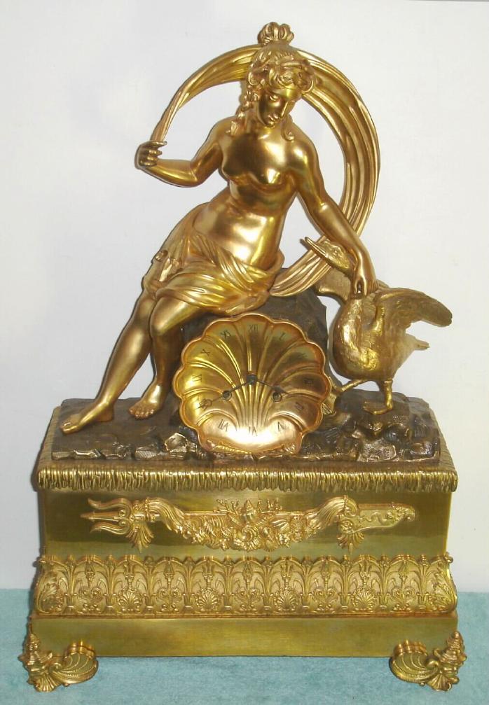 French, large ormolu figural clock, Amphitrite, wife of Neptune, in a classic pose petting her goose, who is often depicted pulling her across the waves in a shell boat. With a bell strike silk thread movement, bearing only the number 287, 8-day, c.1830. — Antique Clocks Price Guide
