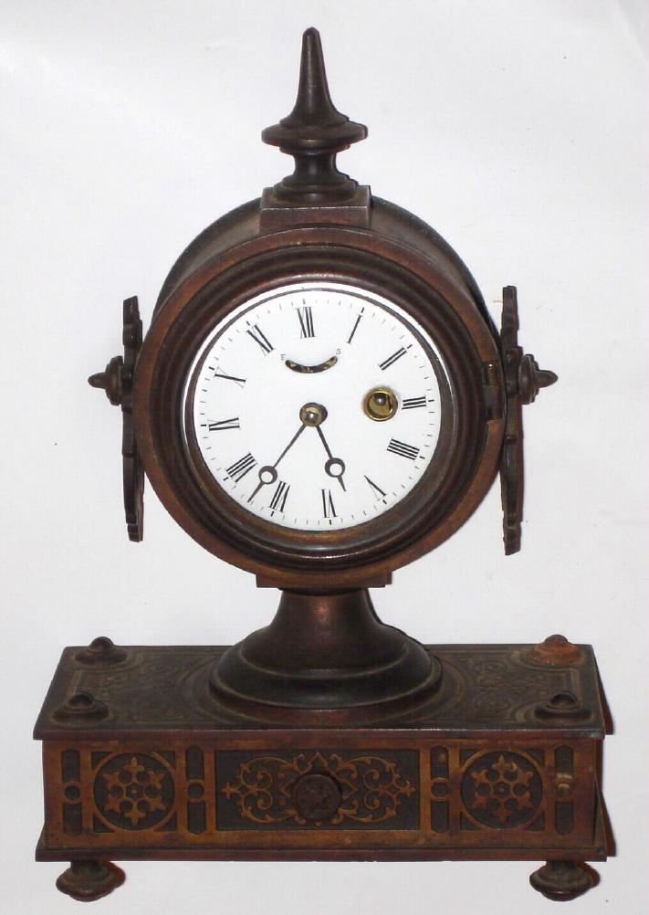 Ansonia Brass and Copper Co.,"TUCKER No. 2", bronze over iron shelf clock with one day balance wheel movement and porcelain dial. — Antique Clocks Price Guide