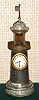New Haven Clock Co., LIGHTHOUSE novelty, the movement in the base, and the detached balance in place of the beacon, and with glass rods to simulate the lantern, c.1889