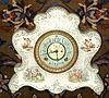 Ansonia Clock Co., unknown porcelain model, probably a Wringer premium, with 4 small cameos of children at play {fishing in lower rt cameo}. Best part of this clock is the rare porcelain dial with Arabic numerals on blue circular fields