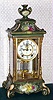 Ansonia Clock Co., New York, "CRYSTAL REGULATOR No. 1", 4- glass mantel regulator in green with floral decorations and gold accents, 8-day with open escapement and striking on a gong.