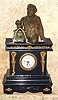 German, BELL RINGER alarm, C.1875, an ebonized pine case with pressed brass trim, and with a small back wind pendulette [short pivoted pendulum] movement. 3rd hand for alarm set on small porcelain dial.