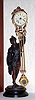 Ansonia Clock Co. New York, C.1880, "FISHER" canister swing clock (3" dial), on early shallow base. Note cast figure hold the clock arm aloft, and the entire arm swings without apparent impulse.