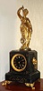 French, Guilmet patent, "MYSTERY" clock, the movement housed in a heavy marble base, and the statue standing on a well hidden carriage that is free to turn back and forth. An arm on the carriage extends into the movement. The pendulum pulls on the carriage in one direction, unlocking the escapement, and then the carriage is given a push in the opposite direction keeping the sequence going, c.1885