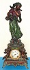 Ansonia Clock Co. New York, C.1896, "SYBIL and WINTER", cast metal figural clock with muted deco colors, 8-day time and strike with porcelain dial.