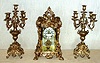 Ansonia Clock Co. New York, C.1905, "APEX and CANDELABRAS", 3-pc set, 8-day, gong strike, with open escapement on porcelain dial.