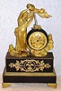 French, Waterfall Automaton, C.1860, with a small bell strike movement with early cylinder platform. The twisty glass tube simulates water pouring from the maidens jug above the clock. The automaton is a separate movement in the base of the clock, wound from the right side.