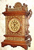 Ansonia Clock Co., New York, C.1894 "CABINET - F", antique oak cased mantle clock with brass trimmings. Has fancy embossed brass dial with raised Arabic numerals, This case with little brass fence or balustrade across the top , and with fancy brass bases to the ball finials.
