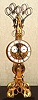 Chinese, Timepiece skeleton clock, C. 2005, "SCISSORS" pendulum model, after the original by Englishman John Wilding. With a brass edged glass case, with hinged front door; rear pane of case is a mirror. 8-day fusee. This model is still sold by ProClocks of Cincinnati.