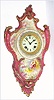 Ansonia Clock Co., C.1906, Royal Bonn, "PORCELAIN HANGING No. 3" china cased wall clock, with flower pattern to case, bell strike balance wheel, 8-day mov't. Color is a lt brownish rose or mauve.