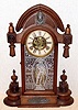 H. J. DAVIES, New York, C.1875, walnut parlor clock, the ORIENTAL, with label on back, 8-day time and strike, with double barrel pendulum {w/ Davies Patent imprint}.