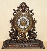 Ansonia Clock Co., New York, C.1886 "RENAISSANCE", cast metal mantel clock in Antique Brass finish, 8-day premium embossed movement and special cast pendulum bob with 2 cherubs flanking the Ansonia logo.