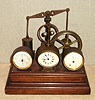 French, Clock / Automaton with Barometer and Thermometer, C.1880. This is a well made and interesting piece, wound through the bottom, and actuated with a pull to the left side which allows the "steam pump" to run for a few minutes, one revolution of the great wheel, then stop. The clock is a souvenir level, oval dial timepiece with cylinder platform.