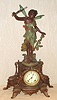 Ansonia Clock Co., New York, C.1880, "OLYMPIA and CHLORUS" figural clock, with fancy creamy porcelain dial with red accents, the statue and base in new art tints.