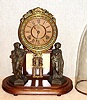 Ansonia Clock Co., Brooklyn, New York, "CRYSTAL PALACE" with dome C.1880, featuring statues of a hunter [rifleman], and a fisher with net, 8-day, bell strike.