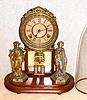 Ansonia Clock Co., Brooklyn, New York, "CRYSTAL PALACE" with dome C.1880, featuring statues of a hunter [rifleman], and a fisher with net, 8-day, bell strike.