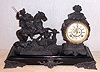 Ansonia Clock Co., New York, C.1904, "BOAR HUNTER", on later style large base, and with 8-day gong strike movement with open escapement / porcelain dial.