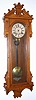 Ansonia Clock Co., "PROMPT", Circa 1901, 8-day spring, time and gong strike in an oak case with carved trim.
