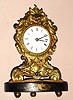 Chauncey Jerome, New Haven, Conn, C.1850, brass repoussse "Paris" model shelf clock with 1-day Botsford patent movement, and original glass dome.