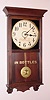 Gilbert "UNIVERSITY" hanging store regulator spring driven time only with 12" Arabic numeral paper over gilt pan dial in polished mahogany case, c1913