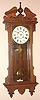 Waterbury Clock Co., C.1905, "ELTON" model, walnut cased wall clock, 8-day, time and gong strike, spring.