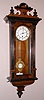 German, C.1875, Wall regulator, 8-day time, spring movt, with fancy cast and gilt R-A pendulum, and porcelain dial, walnut case.