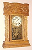 E. Ingraham Co., Bristol Conn. "ATLANTIC" model gingerbread clock from Ingraham's Ocean Line series 8 day time and half hour strike spring driven mvt in oak case with Arabic numeral gilt pan 6" dial, c1915