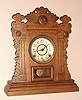 E.N. Welch Mfg. Co., Forestville Conn. "MARTINI" model mantel clock with 8 day time and half hour strike spring driven mvt in oak case with Arabic numeral painted gilt pan dial, c1891