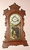 New Haven Clock Co, New Haven Conn "TIBER" model 30 hour time and strike spring driven mvt in walnut case with gilt pan 5 1/2" Roman numeral dial, c1880