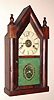 E. and A. Ingraham and Co., Ansonia, Conn. "STEEPLE CLOCK" model 8 day time, strike and alarm spring driven mvt in mahogany veneered case with painted zinc dial, (Had fire Dec. 1855 and were at Ansonia less than a year and went bankrupt. Scarce label)