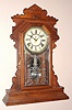 Waterbury Clock Co., Waterbury, Conn. "PAWLING" model 8 day, time and strike spring driven mvt in walnut case with Roman numeral, nickel plated dial pan 6" dial, c1891