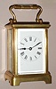 French carriage clock time and half hour strike on gong in corniche case with Roman numeral porcelain dial, c1910